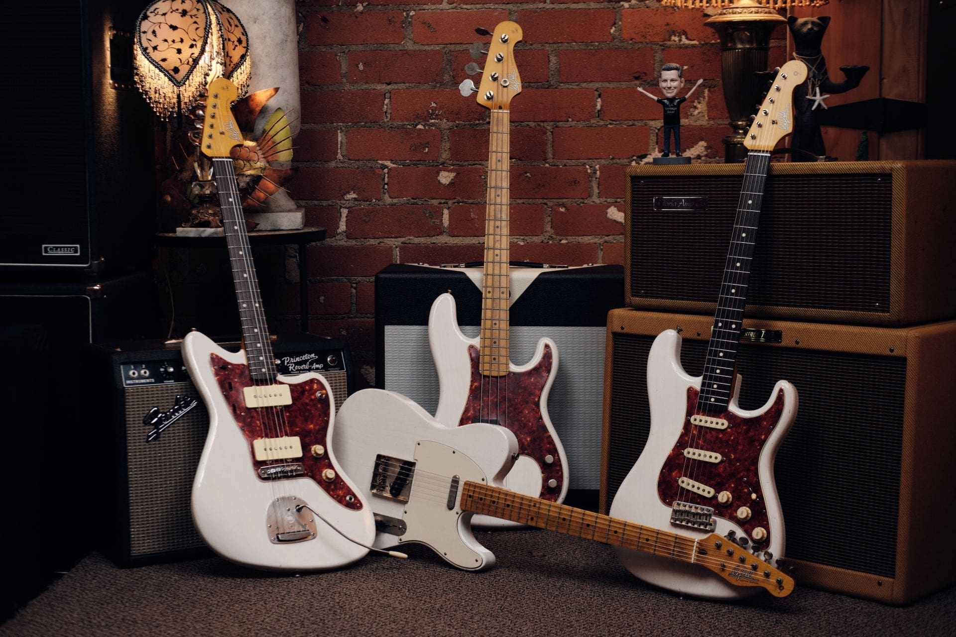 Lelah guitars and bass displayed together with amplifiers at L.A. Vintage Gear